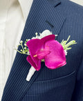 Elegant Orchid Boutonniere with Lush Greenery