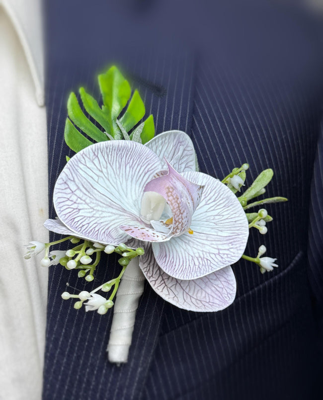 Elegant Grey Orchid Boutonniere with Frosted Greenery