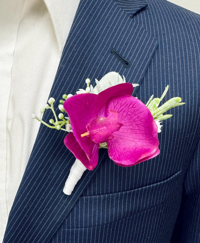 Elegant Orchid Boutonniere with Lush Greenery