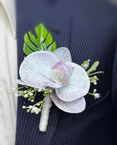 Elegant Grey Orchid Boutonniere with Frosted Greenery